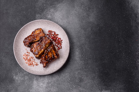 Grilled or bbq pork ribs with sauce, a food prepared for dinner. Grilled ribs as a food background for your designの写真素材