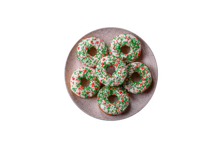 Christmas donuts or doughnuts, holiday winter sweets with chocolate filling and sprinkles. Christmas donuts or donuts as a food background for your design.の写真素材