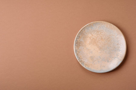 An empty round ceramic plate as a background for your designの写真素材