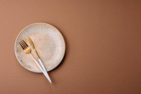 An empty round ceramic plate on a table. An empty plate as a food background for your designの写真素材