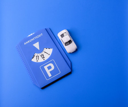 A parking disc, permit, or ticket for measuring time and paying municipal services. A parking disc as a background for your designの写真素材