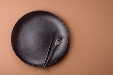 An empty round ceramic plate, kitchenware. An empty plate as a food background for your designの写真素材