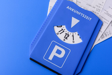 A parking disc, permit, or ticket for measuring time and paying municipal services. A parking disc as a background for your designの写真素材