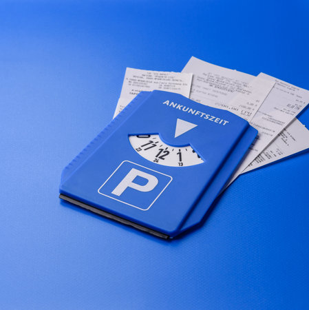 A parking disc, permit, or ticket for measuring time and paying municipal services. A parking disc as a background for your designの写真素材