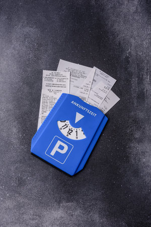 A parking disc, permit, or ticket for measuring time and paying municipal services. A parking disc as a background for your designの写真素材