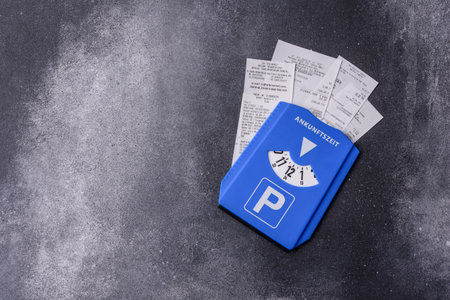 A parking disc, permit, or ticket for measuring time and paying municipal services. A parking disc as a background for your designの写真素材