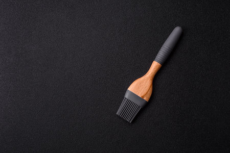 Brush, silicone kitchen utensils for cooking and baking at home. Silicone brush as a background for your designの写真素材