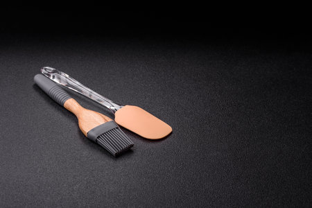 Brush, silicone kitchen utensils for cooking and baking at home. Silicone brush as a food background...