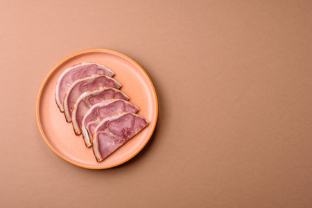 Slices of meat on a plate.の写真素材