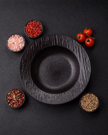 An empty round ceramic plate on a table, kitchenware. An empty plate as a background for your designの写真素材