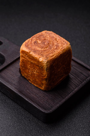 A French cube croissant with chocolate filling, a sweet breakfast pastry. Cube croissant as a food...