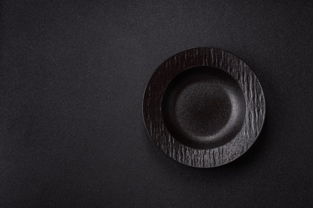 An empty round ceramic plate on a table. An empty plate as a food background for your designの写真素材