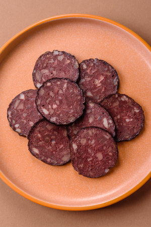 Black blood pudding, grilled pork sausage cooked for dinner. Blood pudding as a food background for...