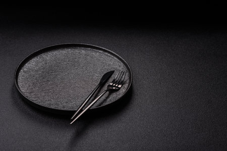 An empty round ceramic plate on a table. An empty plate as a food background for your designの写真素材