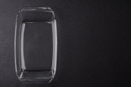 A rectangular transparent glass tray for baking and cooking at home. The glass tray as a food...