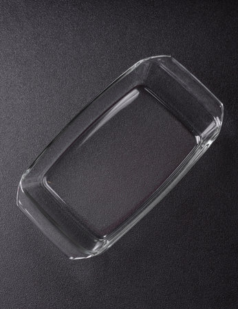 A rectangular transparent glass tray for baking and cooking at home. The glass tray as a food backdrop for your designの写真素材