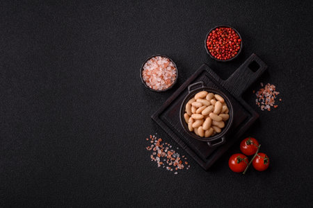 Canned white beans, prepared as an ingredient. Canned beans in a bowl as a food background for your...