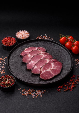 Meat, smoked ham, or pork sausage sliced for breakfast sandwiches. Sliced ham as a food background for your designの写真素材