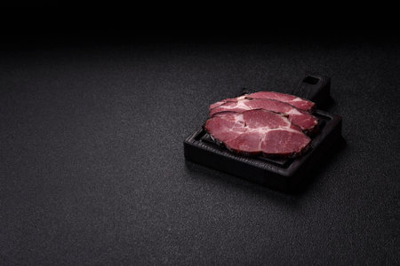 Meat, smoked ham, or pork sausage sliced for breakfast sandwiches. Sliced ham as a food background for your designの写真素材