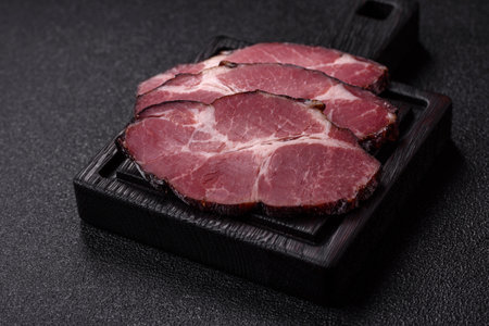 Meat, smoked ham, or pork sausage sliced for breakfast sandwiches. Sliced ham as a food background for your designの写真素材