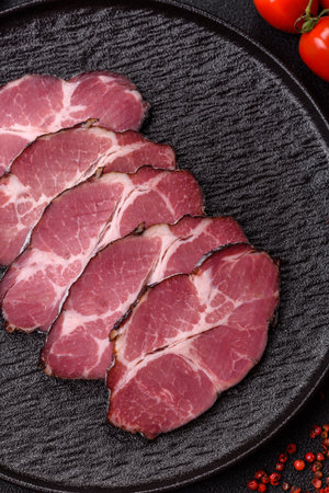 Meat, smoked ham, or pork sausage sliced for breakfast sandwiches. Sliced ham as a food background for your designの写真素材