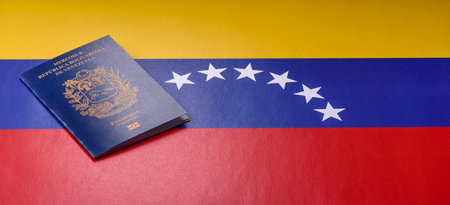 Venezuelan passport for international travel and vacation. Venezuelan passport as a background for your designの写真素材