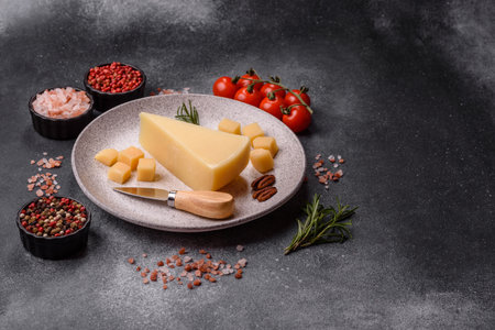 A wedge of cheese on a cutting board. Cheese wedge as a food background for your designの写真素材