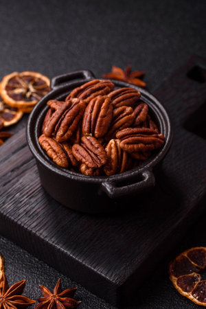Peeled and roasted pecan nut as an ingredient for healthy foods and snacks. Pecan nut as a food background for your design.の写真素材