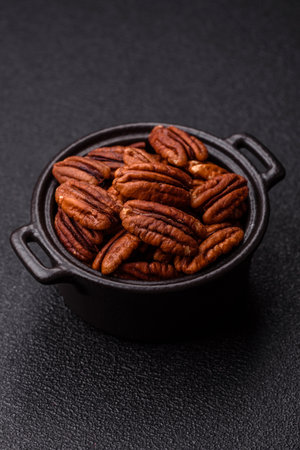 Peeled and roasted pecan nut as an ingredient for healthy foods and snacks. Pecan nut as a food...