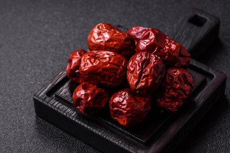 Red dried dates, the sweet fruit jujube, as a healthy food. Red dates, jujube as a food background...