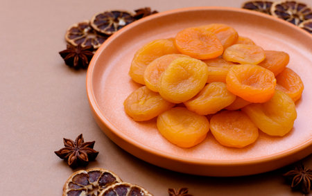 Dried apricots are a sweet, healthy fruit for vegans and vegetarians. Dried apricots as a food background for your designの写真素材