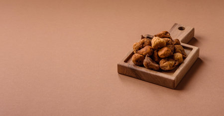 Dried figs are a sweet, healthy fruit for vegans and vegetarians. Dried fig as a food background for...
