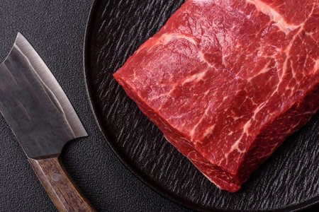 A piece of raw beef, a tenderloin for grilling or barbecue. Raw beef as a food background for your designの写真素材