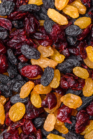 Dried cranberries, yellow and black sweet raisins as ingredients for granola and breakfast. Raisins...