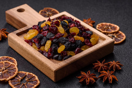 Dried cranberries, yellow and black sweet raisins as ingredients for granola and breakfast. Raisins...