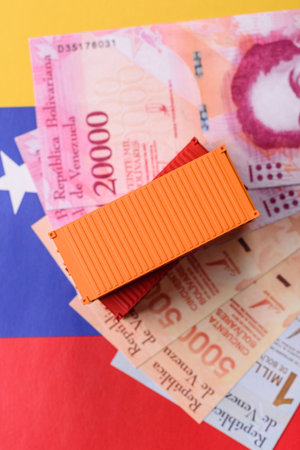 Cargo containers on the Venezuela flag as a conceptual backdrop for goods export and logistics....