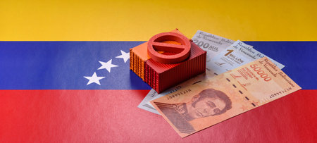 The cargo container ban on the Venezuela flag as a conceptual backdrop for the export and logistics of goods. The cargo container embargo on the Venezuela flag as a backdrop for your designの写真素材