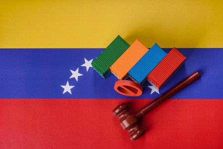 The cargo container ban on the Venezuela flag as a conceptual backdrop for the export and logistics of goods.の写真素材