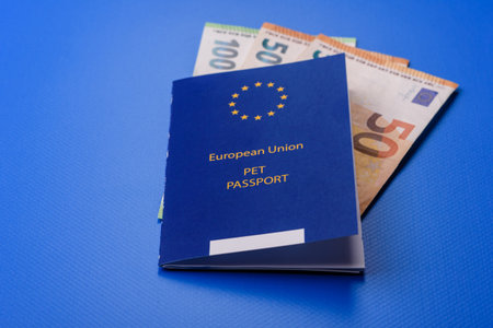 A pet passport is a document with vaccination and travel information for a cat, dog, or other animal. A pet passport as a background for your design.の写真素材