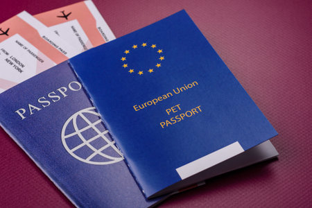 A pet passport is a document with vaccination and travel information for a cat, dog, or other animal. A pet passport as a background for your design.の写真素材