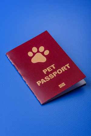 A pet passport is a document with vaccination and travel information for a cat, dog, or other animal. A pet passport as a background for your design.の写真素材
