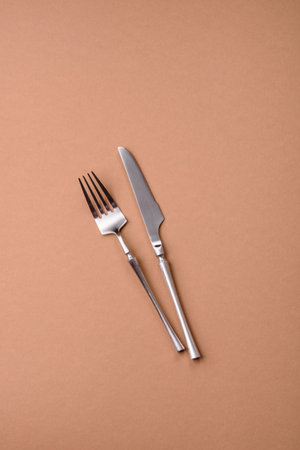 A knife and fork, silver kitchen utensils for the dining table. A knife and fork as a background for...