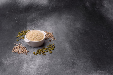 White sesame seeds in a bowl, an ingredient for oil and healthy eating. White sesame as a food background for your designの写真素材