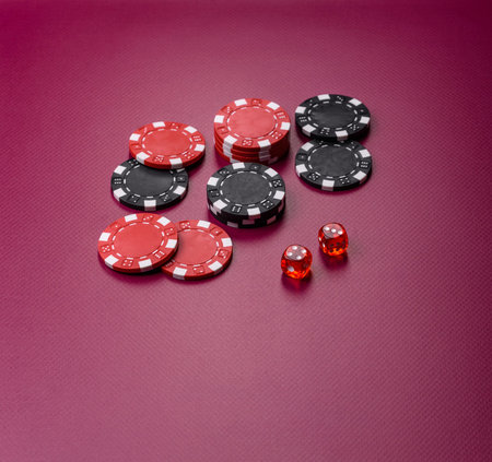 Casino dice and chips on a colored background, poker, gambling with bets. Dice and chips as a...