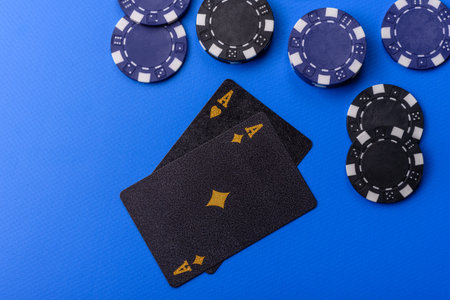 Casino, cards and chips on a colored background, poker and blackjack, gambling with bets. Cards and chips as a background for your designの写真素材
