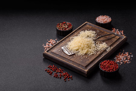 Grated cheese as a cooking or baking ingredient. Grated cheese as a food background for your designの写真素材