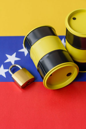 Metal barrels of oil, gas, or chemicals bearing on the flag of Venezuela and a ban sign, embargo on...