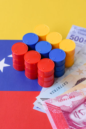 Metal barrels of oil, gas, or chemicals on the Venezuelan flag. Barrels of oil as a background for your designの写真素材