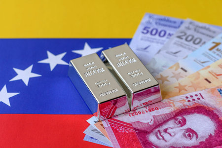 A silver bar, white metal against a flag of Venezuela, as a concept for the sales market. A silver bar as a background for your designの写真素材