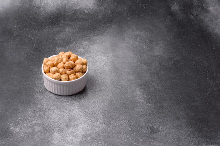 Whole peeled hazelnuts, roasted or raw, as an ingredient for healthy food. Hazelnuts as a background...